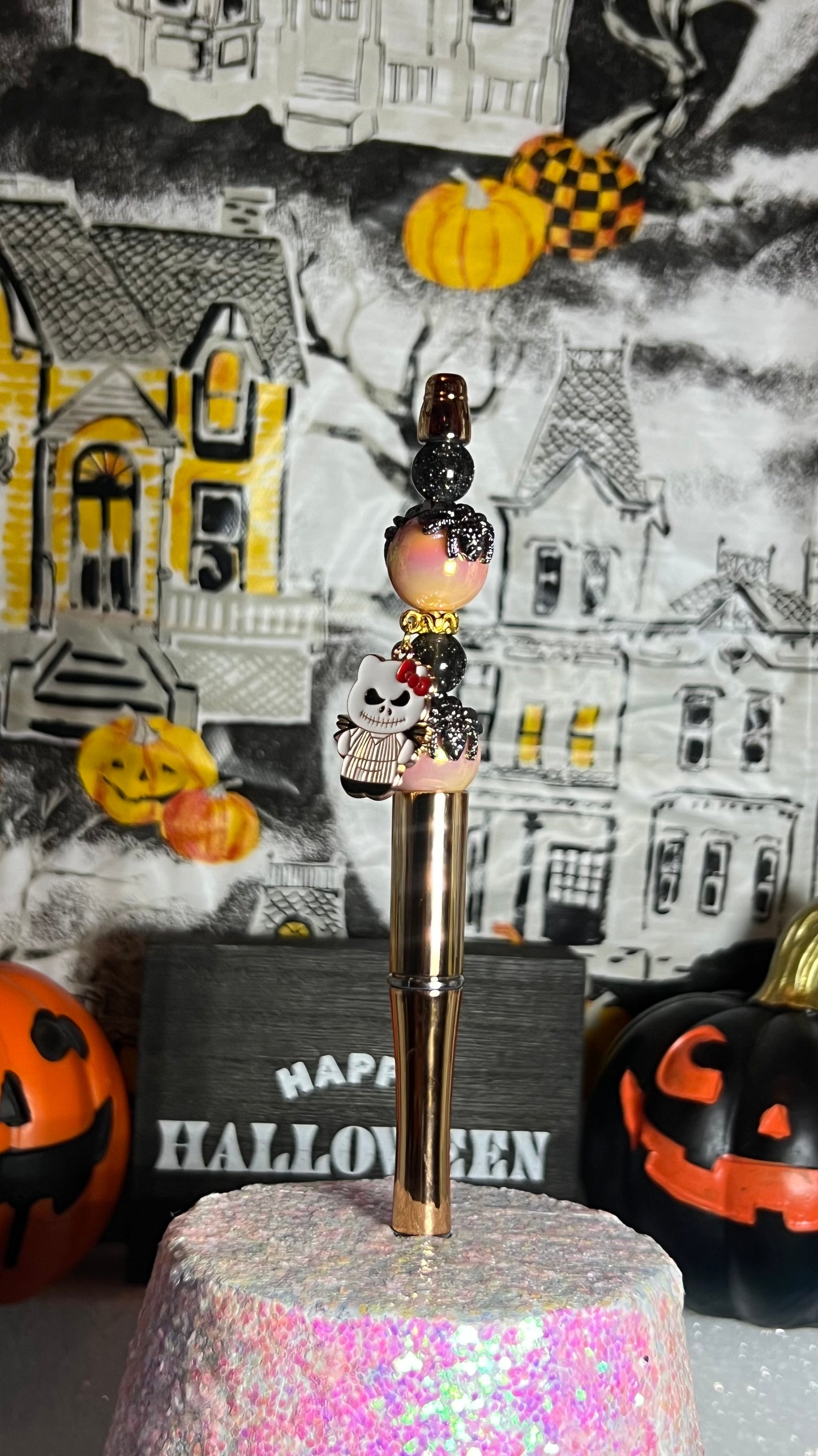 Spider pen with hello kitty x nightmare before Christmas charm